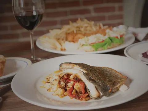 Pan-seared trout and a fried seafood platter at Public House