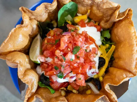 Taco salad in a fried tortilla bowl at Chili Peppers