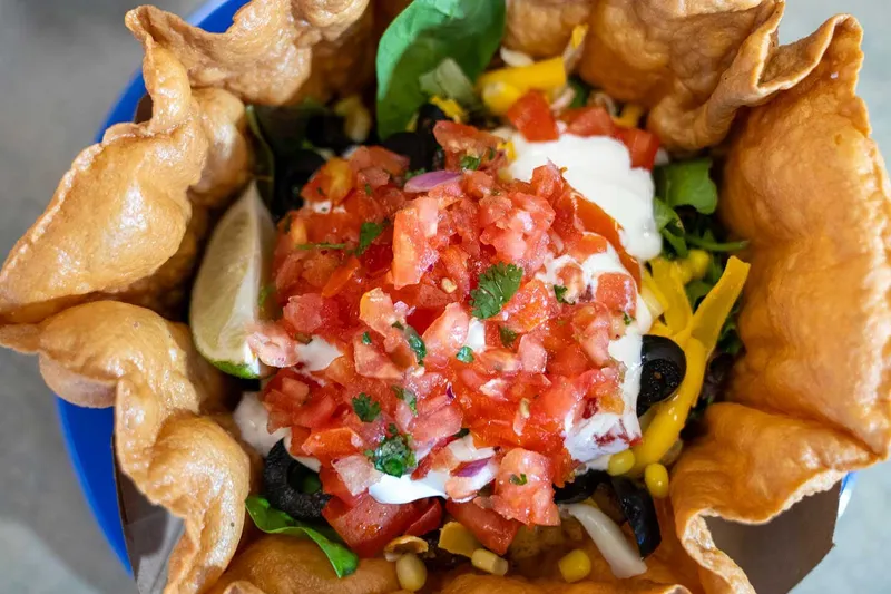 Taco salad in a fried tortilla bowl at Chili Peppers