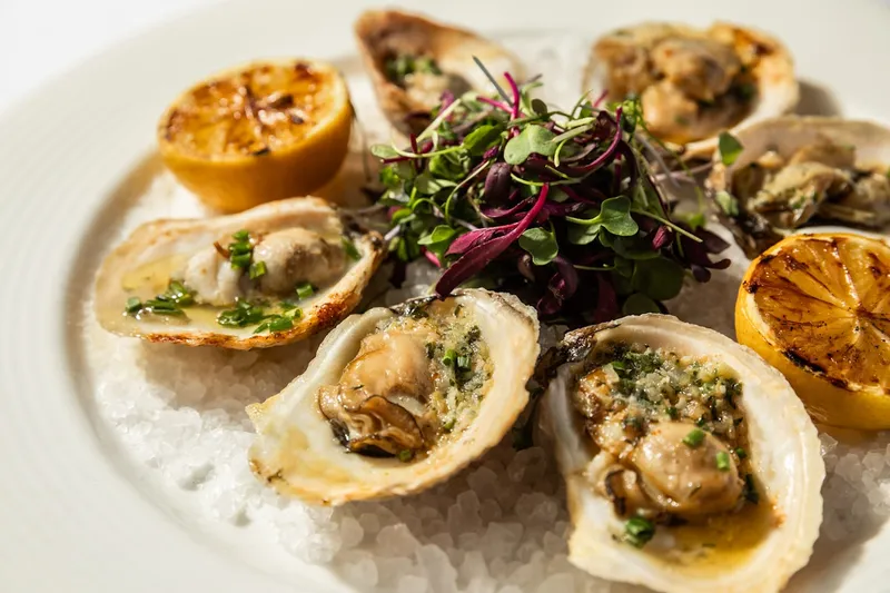 Char-grilled oysters on an open flame at Bridgeman's Chophouse