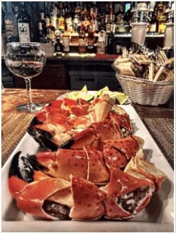 Platter of crab legs with red wine sauce at Garcia's Seafood Grille & Fish Market