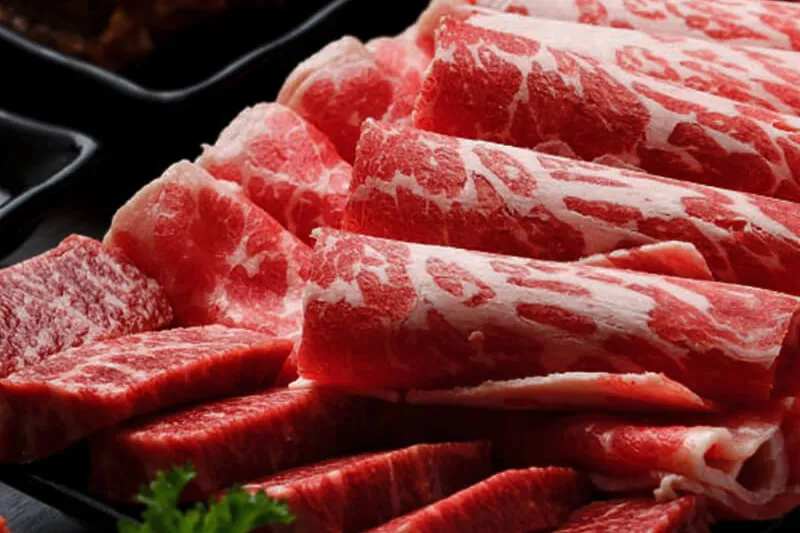 Platter of marbled prime beef cuts for the grill at Park's BBQ