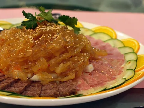 Top Gun Appetizer Platter at Top Gun Seafood Restaurant — jellyfish, sliced beef shank and ham with cucumber and orange garnish