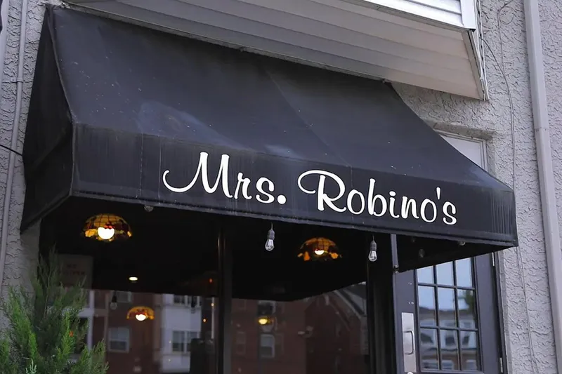 Black awning lettered Mrs. Robino's over the entrance in Wilmington's Little Italy