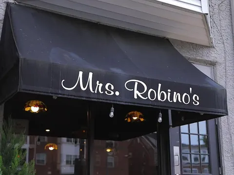 Black awning lettered Mrs. Robino's over the entrance in Wilmington's Little Italy