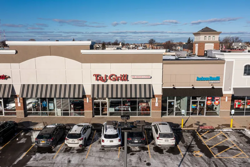 Taj Grill's storefront in a Delaware Avenue retail plaza in Buffalo
