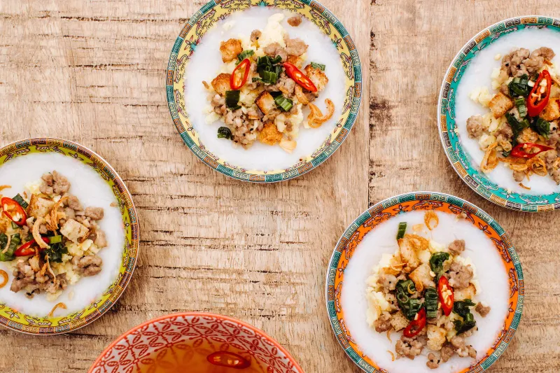 Banh beo (steamed water fern rice cakes) on colorful plates at Hai Hai in Minneapolis