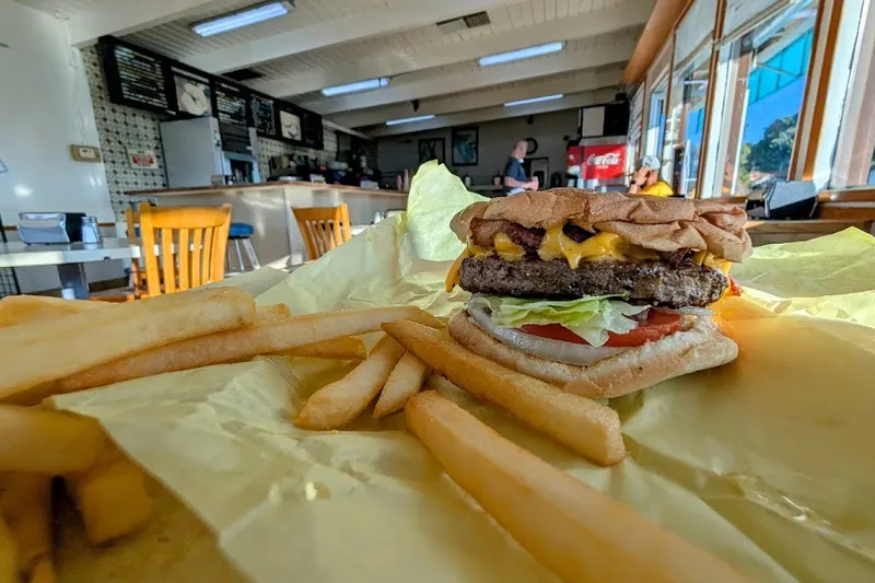 A cheeseburger and fries inside Allstar Burger in Newark.