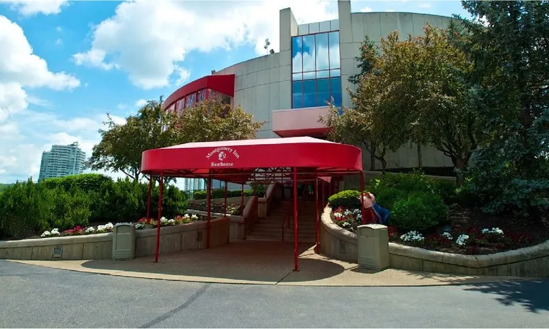 Red-canopied entrance of Montgomery Inn The Boathouse overlooking the Ohio River