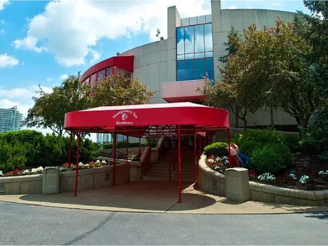 Red-canopied entrance of Montgomery Inn The Boathouse overlooking the Ohio River