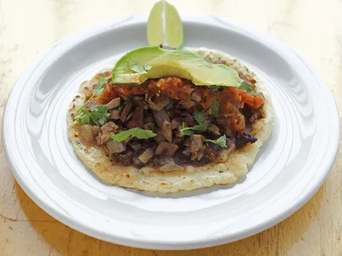 Taco de poc-chuc — grilled marinated pork with black beans, salsa roja, cilantro and avocado on a handmade tortilla — at Poc-Chuc in San Francisco