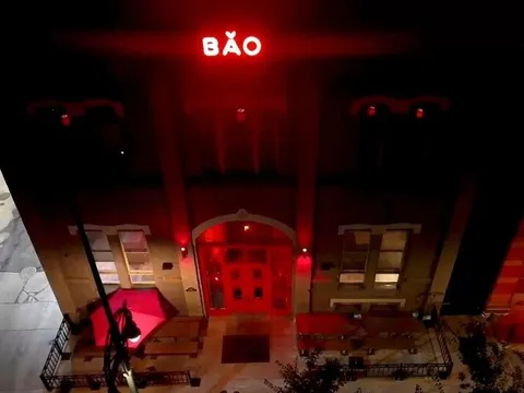 Bao Brewhouse entrance glowing red beneath its neon BAO sign