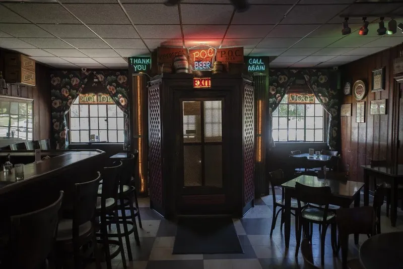 Interior of Prosperity Social Club with vintage neon signage