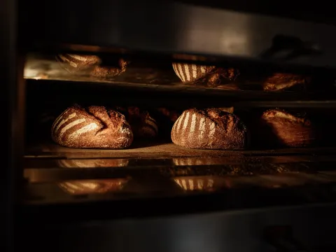 Fresh sourdough loaves in the oven at Niedlov's Breadworks