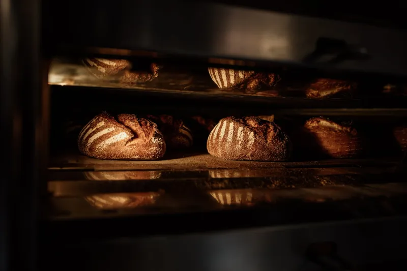 Fresh sourdough loaves in the oven at Niedlov's Breadworks