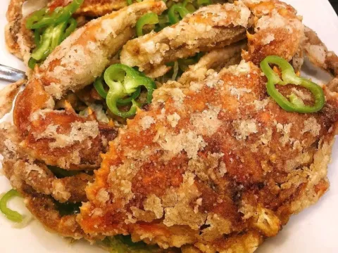 Plate of fried food topped with sliced chili at Great NY Noodletown