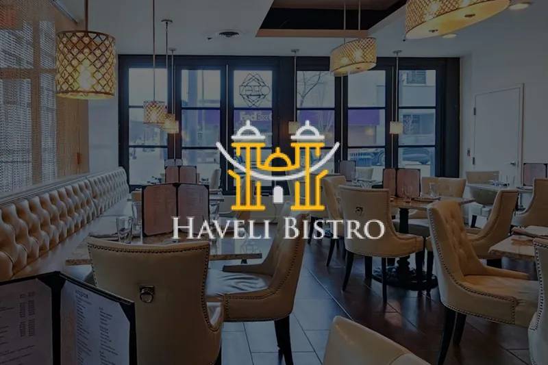 Booth seating and pendant lighting in the dining room at Haveli Bistro