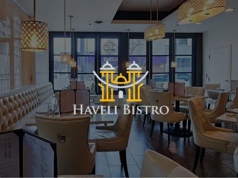 Booth seating and pendant lighting in the dining room at Haveli Bistro