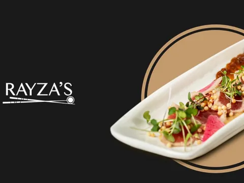 Sushi roll plated on a long white dish beside the Rayza's logo