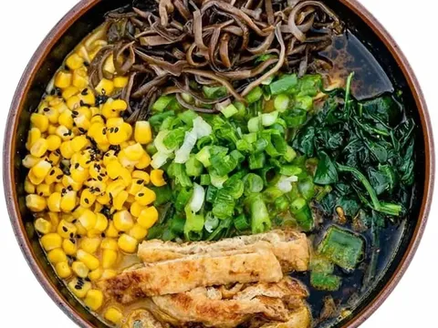 Bowl of ramen with corn, scallions, spinach, and mushrooms at Ramen Tatsu-ya