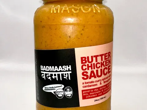 Jar of Badmaash butter chicken sauce on a white background