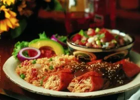 Enchilada plate with rice, avocado and pico de gallo at Mi Tierra Cafe y Panaderia