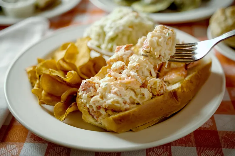 Lobster roll with coleslaw and chips at Grand Central Oyster Bar