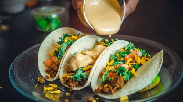 Freshly hand-pressed corn tortilla tacos with grilled marinated pork and rajas at La Super-Rica Taqueria