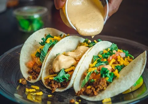 Freshly hand-pressed corn tortilla tacos with grilled marinated pork and rajas at La Super-Rica Taqueria