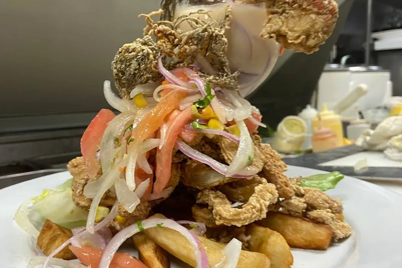 Jalea Tullpa seafood platter with fried plantains at Tullpa Peruvian Restaurant