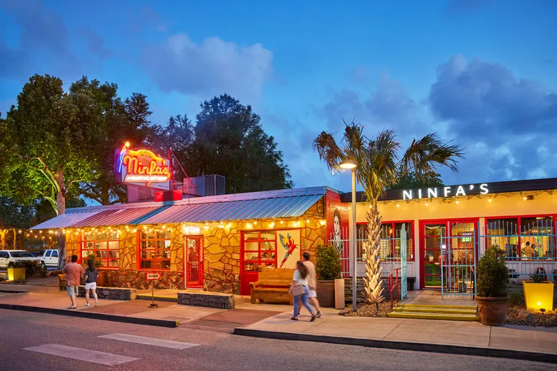 Lit exterior and patio of Ninfa's on Navigation at dusk