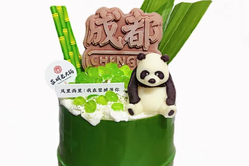 Chengdu Memory's signature matcha snow ice served in a bamboo cup with a panda decoration and Chengdu branding