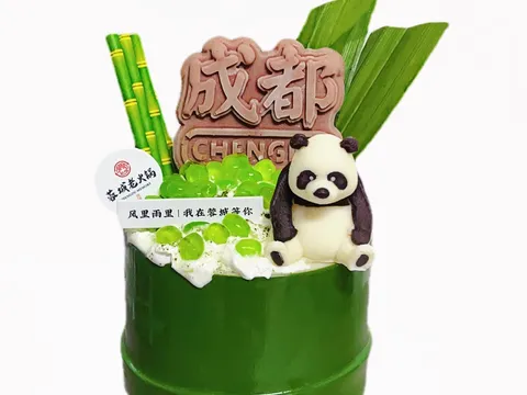 Chengdu Memory's signature matcha snow ice served in a bamboo cup with a panda decoration and Chengdu branding