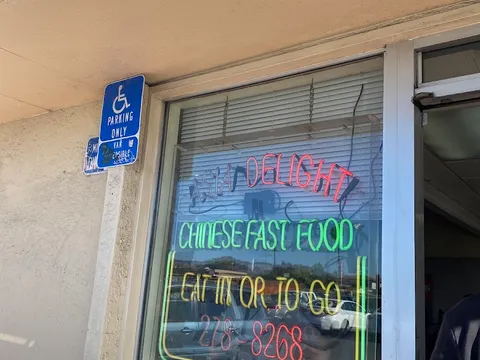 Asia Delight neon window sign in San Leandro