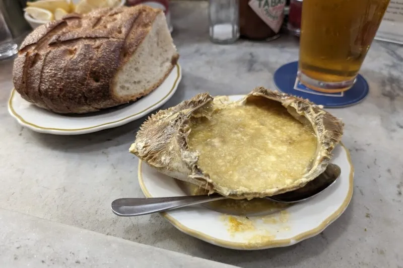 Half cracked crab and sourdough bread at Swan Oyster Depot's marble counter