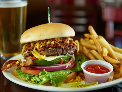Angry Dog burger with fries and a beer
