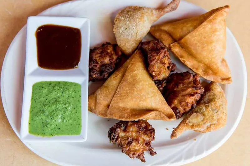 Assorted fried appetizer platter with tamarind and mint chutney at Bombay Bar & Grill
