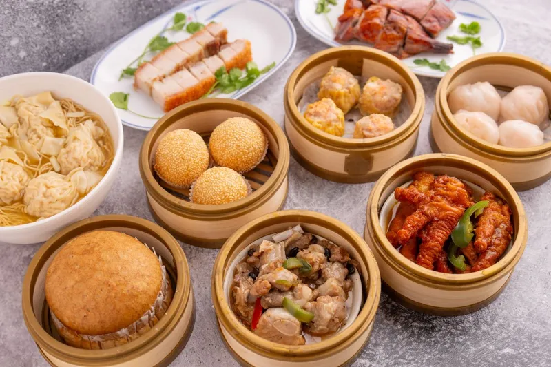 Steamer baskets of dim sum and roast meats at Daimo
