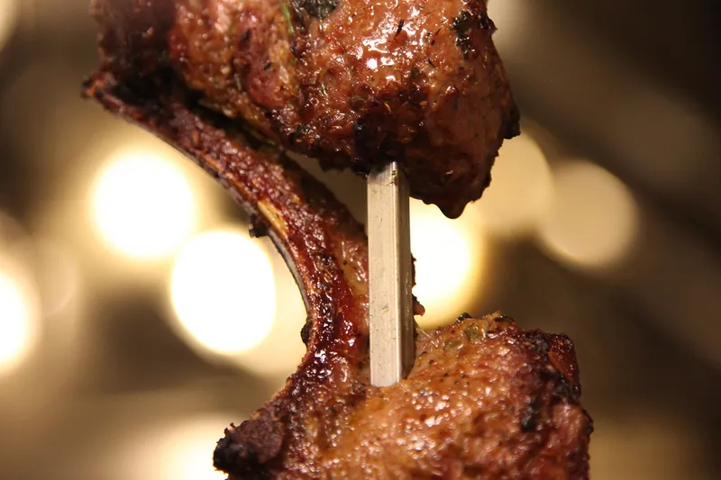 Charcoal-grilled lamb chops on a skewer at London Sizzler, Houston