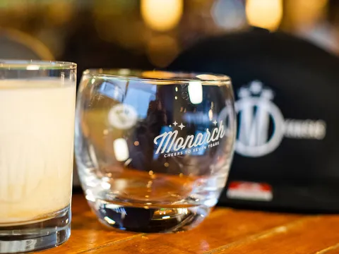 Monarch branded rocks glasses on the bar at The Monarch in Wichita