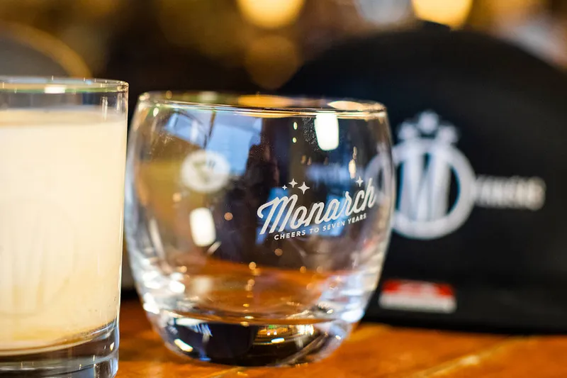 Monarch branded rocks glasses on the bar at The Monarch in Wichita