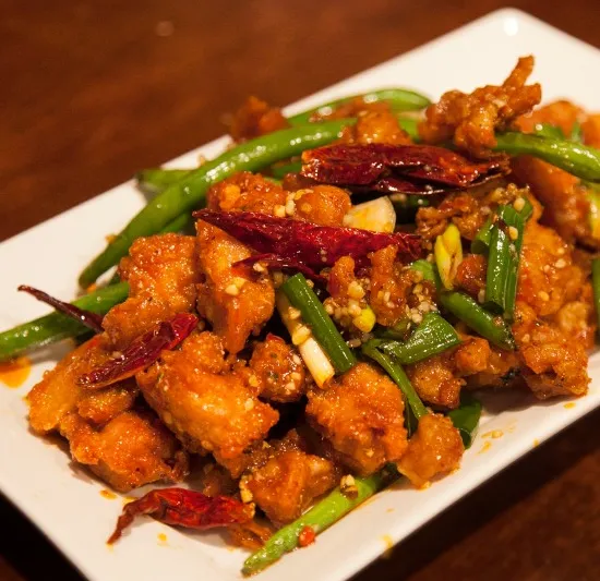 Chong Qing hot chicken at Spicy Talk Bistro — crispy fried chicken pieces tossed with dried chilies, green beans and scallions