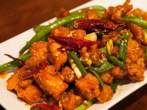 Chong Qing hot chicken at Spicy Talk Bistro — crispy fried chicken pieces tossed with dried chilies, green beans and scallions