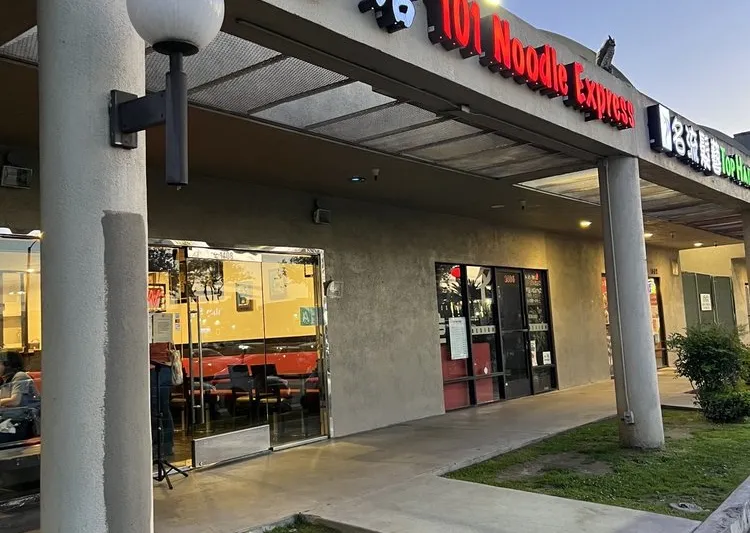 Storefront of 101 Noodle Express in Alhambra, with neon signage