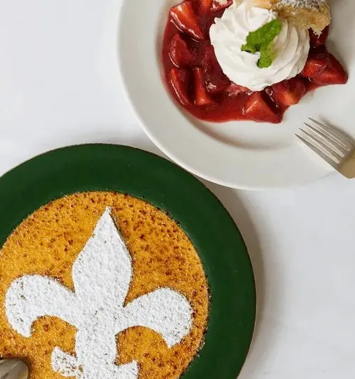 Bread pudding souffle and strawberry shortcake dessert plates at Commander's Palace