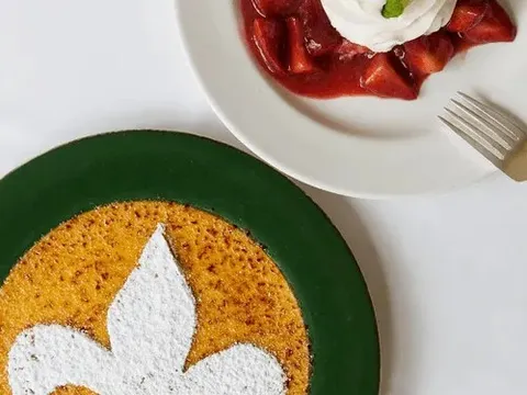 Bread pudding souffle and strawberry shortcake dessert plates at Commander's Palace