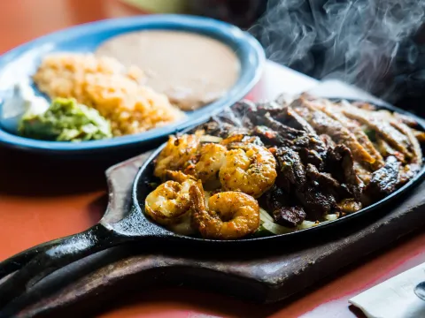 Sizzling fajita skillet with shrimp and steak at Jalisco Restaurant