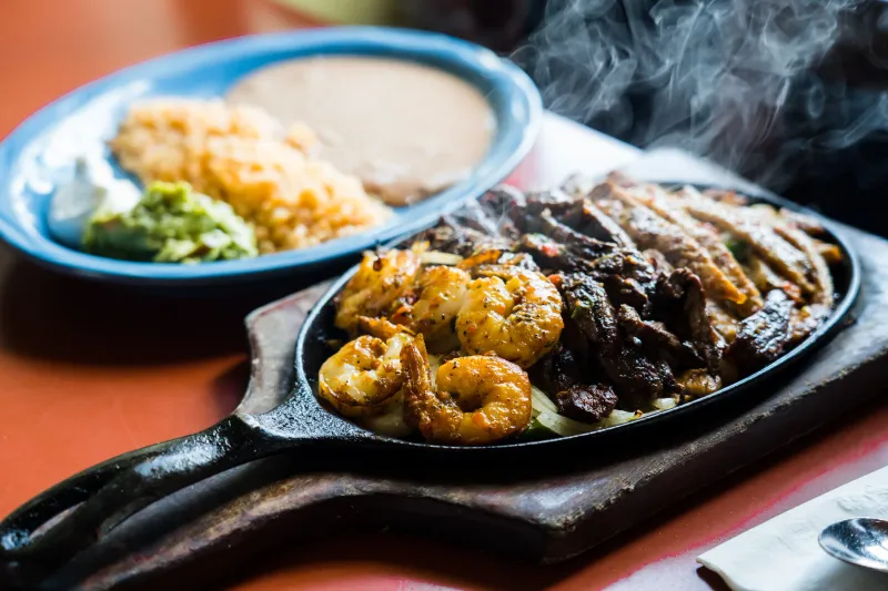 Sizzling fajita skillet with shrimp and steak at Jalisco Restaurant