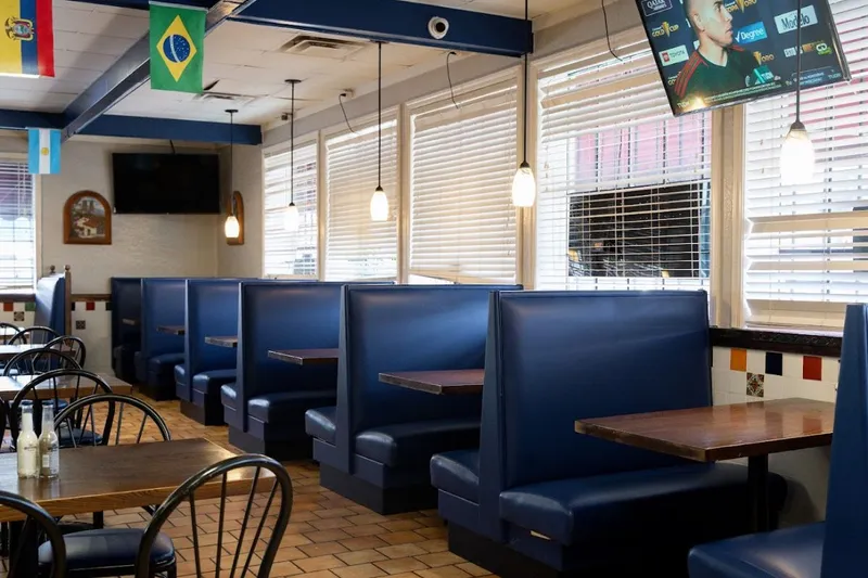 Blue booth seating along a window at Taqueria Mexico 2