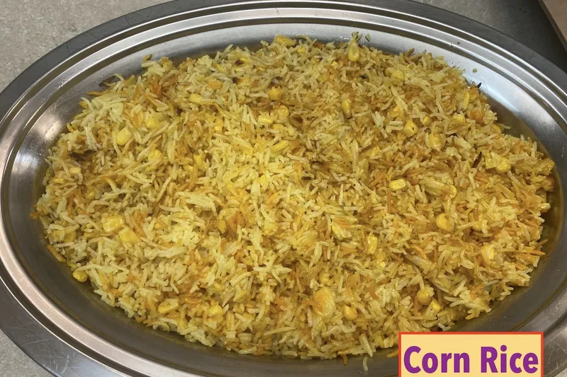 Tray of golden corn rice prepared by Kumari Restaurant in Baltimore
